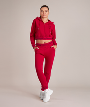 athletic crop top hoodie in red for women at gym