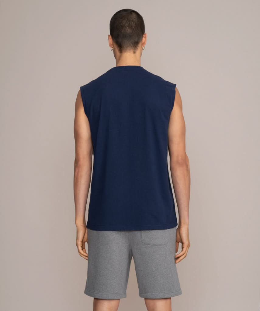 back view of man in navy blue gym tank