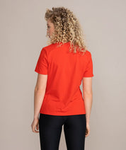 back view of woman in red shirt