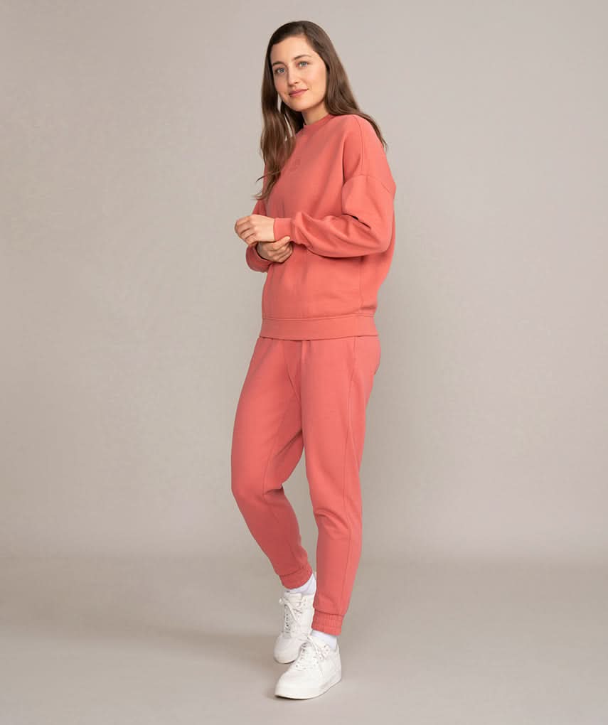 female model showing off golds gym sweater