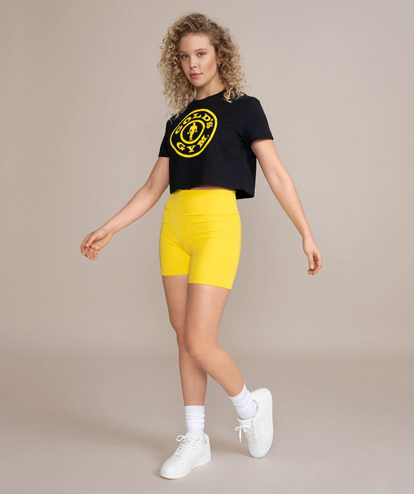 female model wearing golds gym crop top