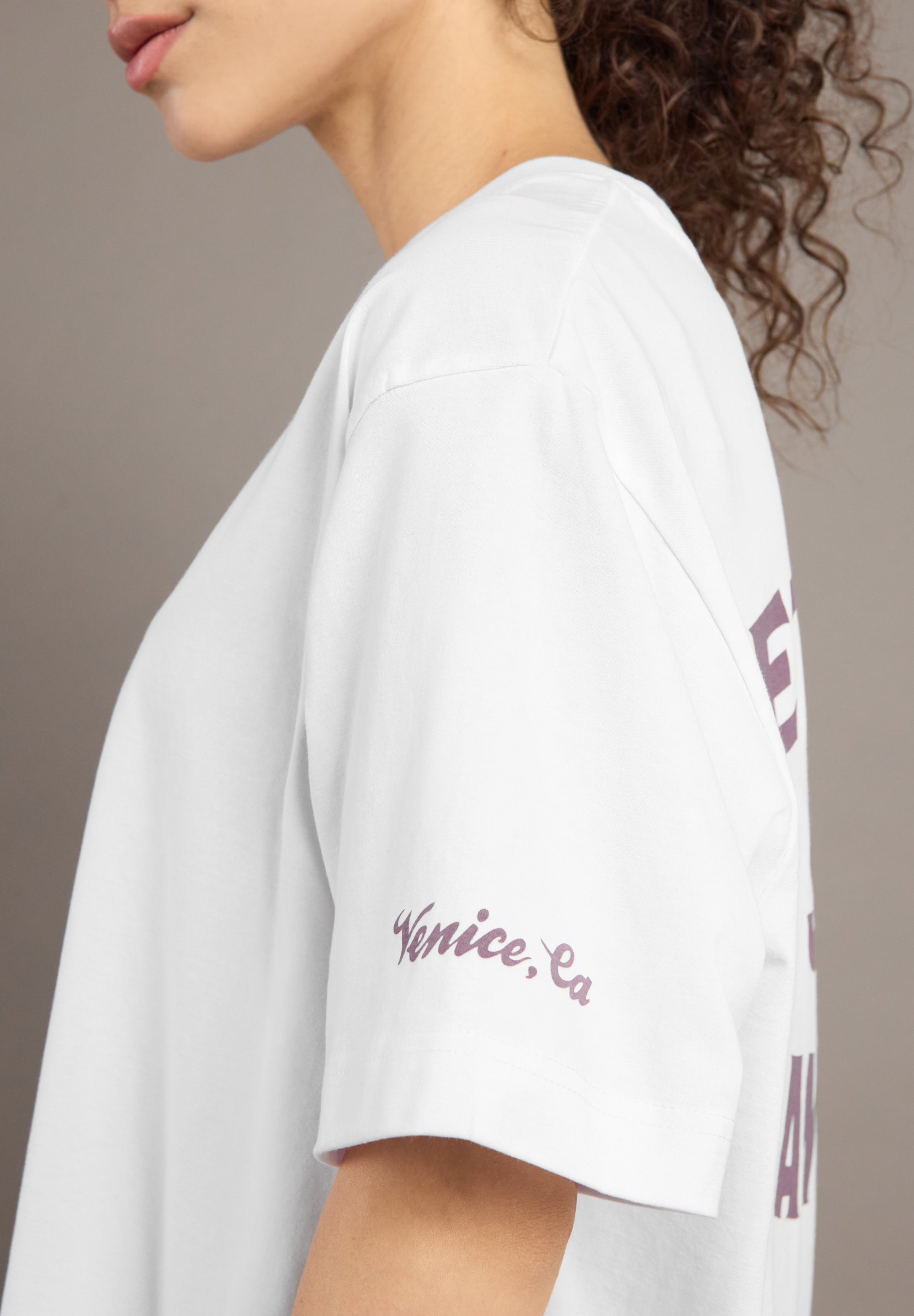 White t-shirt with 'Venice, CA' text on a neutral background