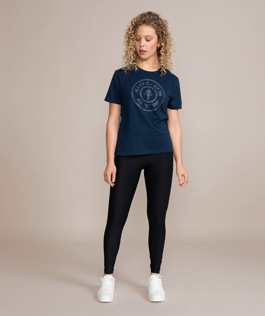 woman in golds gym shirt