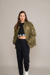 woman in green golds gym jacket