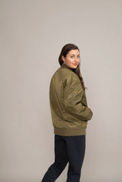 woman in green jacket