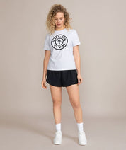 woman looking down in gray golds gym shirt