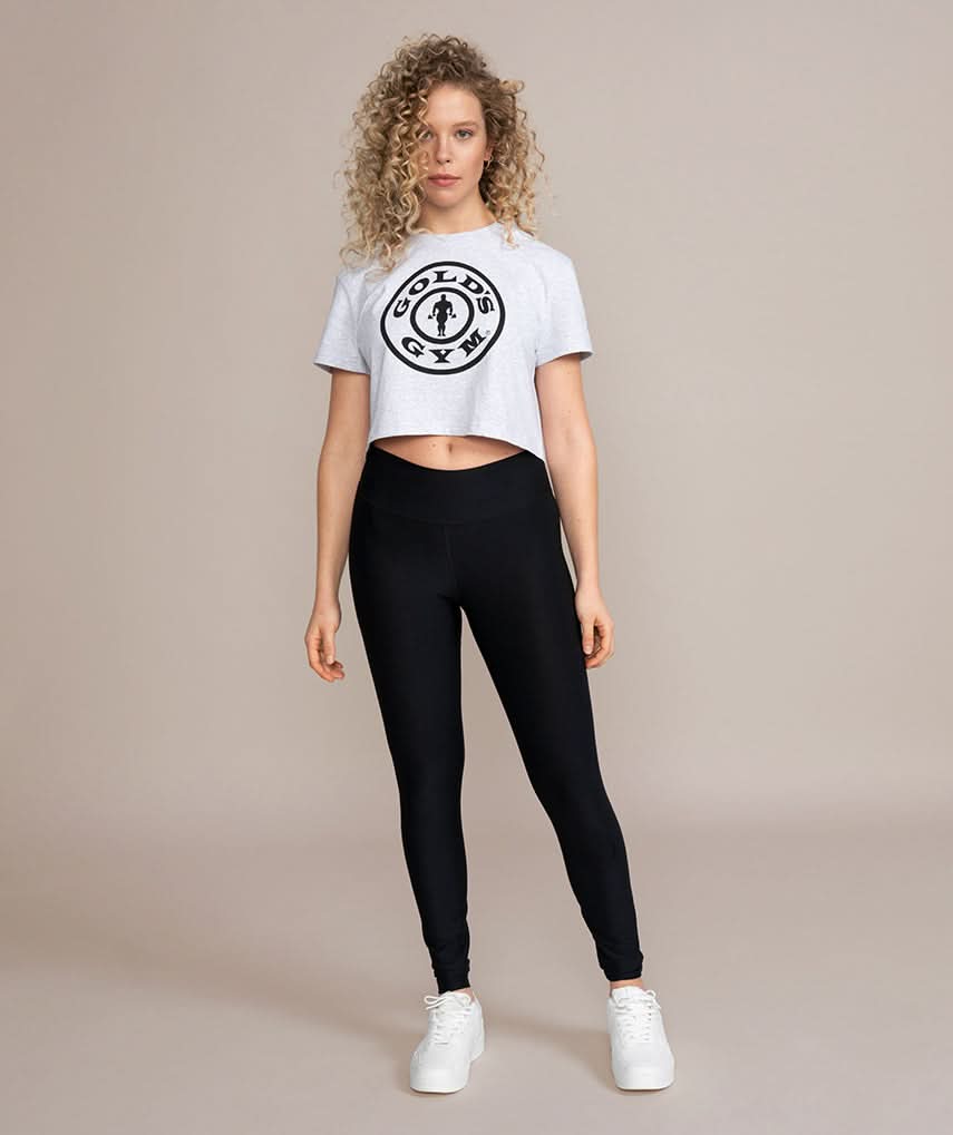 woman model wearing gray crop top from golds gym