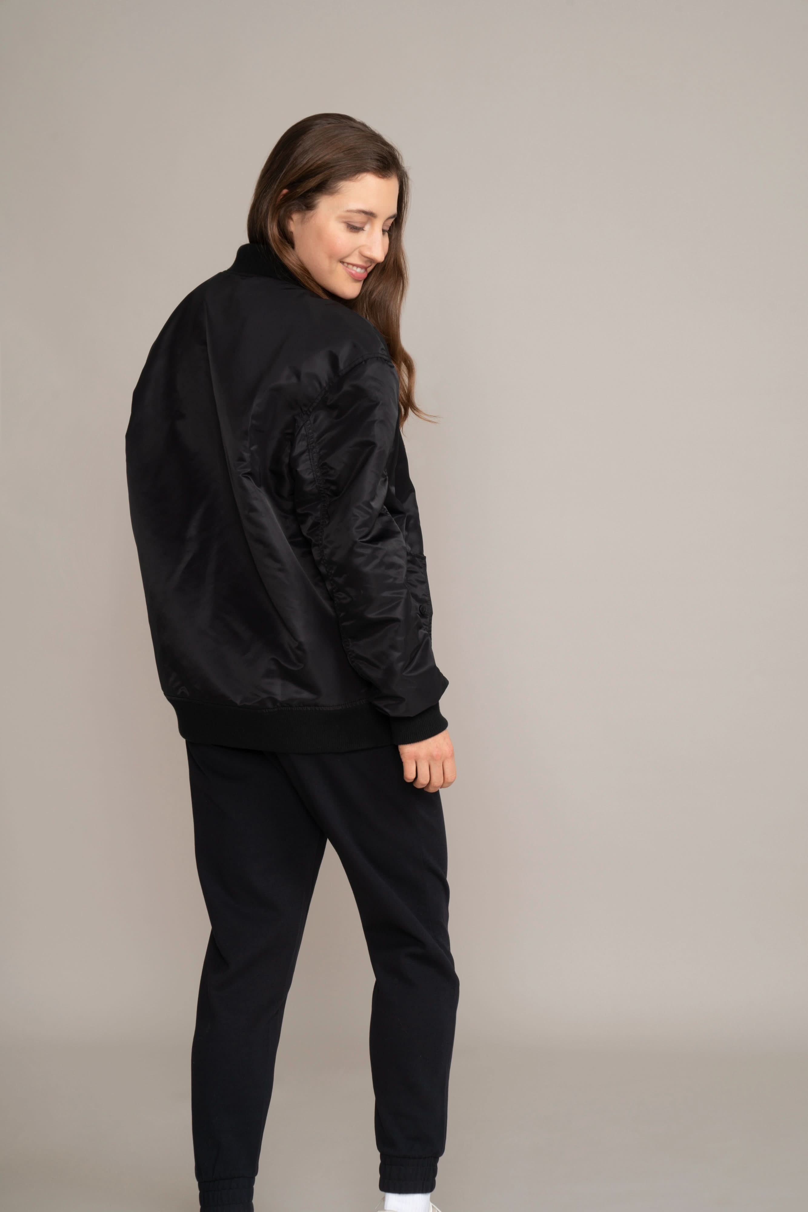 woman wearing bomber jacket