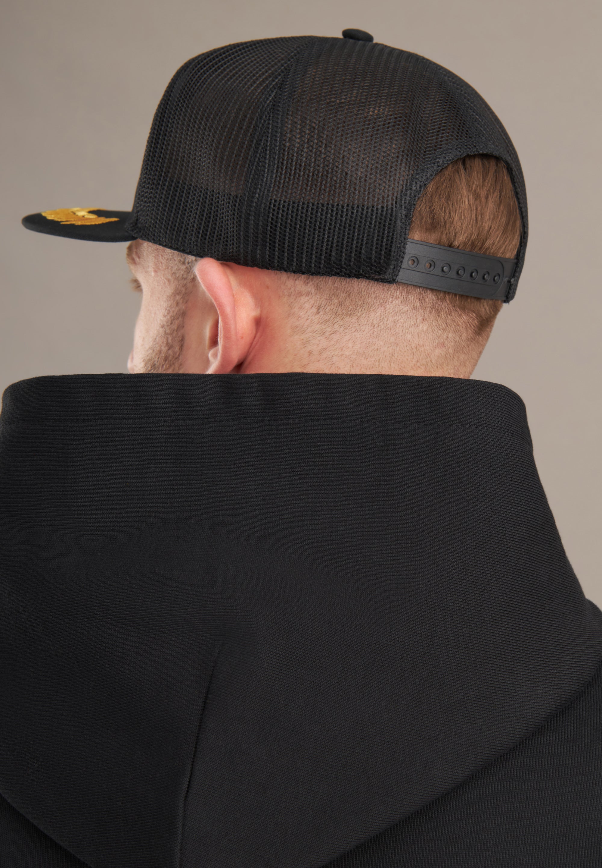 back of black trucker hat