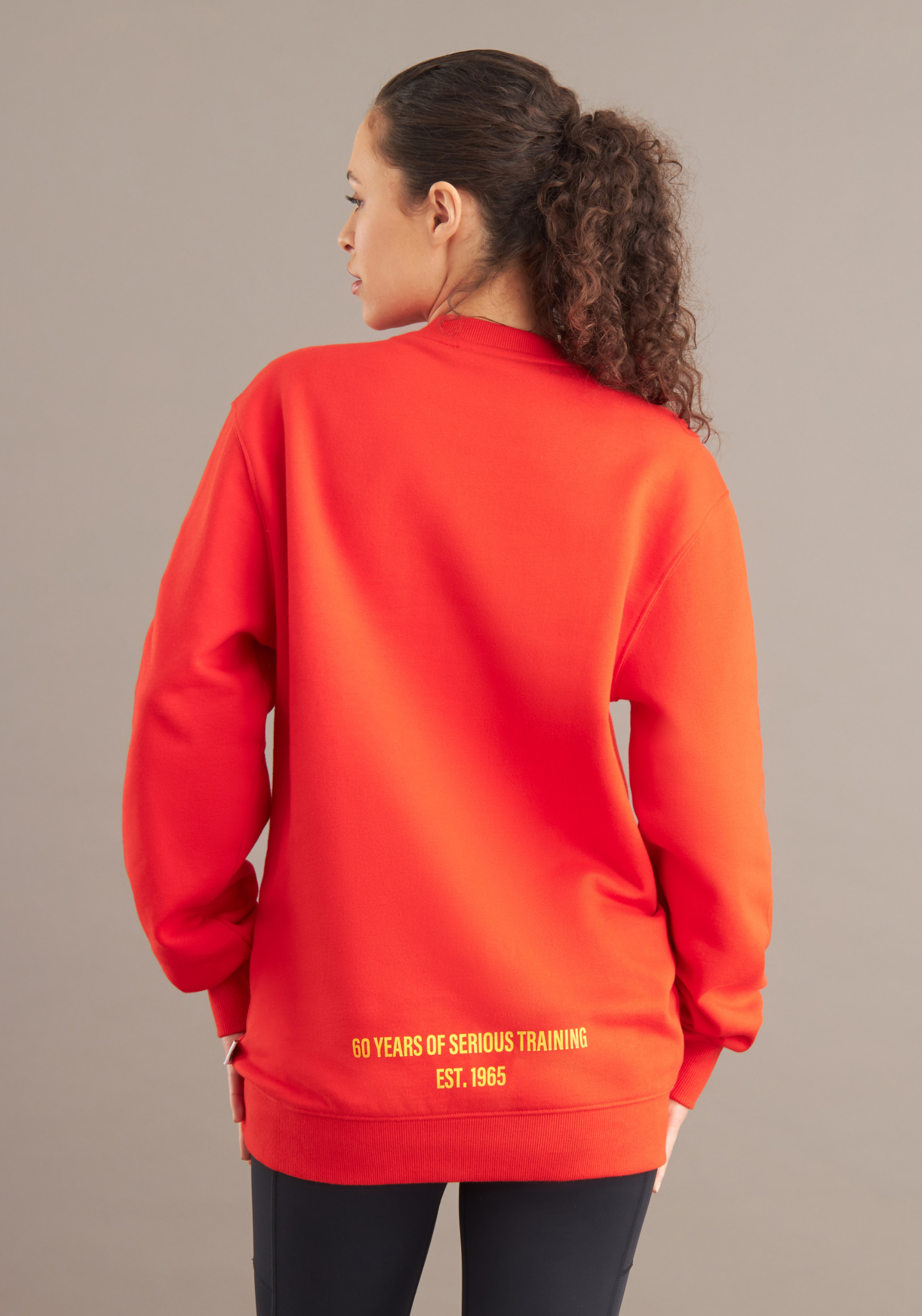 back of woman wearing red sweater 