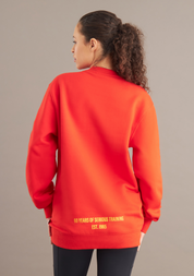 back of woman wearing red sweater 