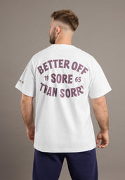 Man wearing a white t-shirt with text on the back against a gray background
