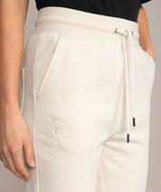 cream colored off white sweatpants embroidered 