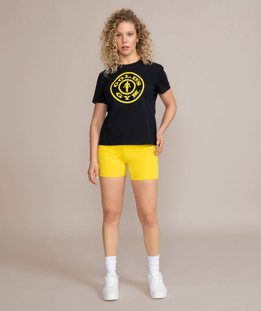 female model in golds gym black and gold shirt