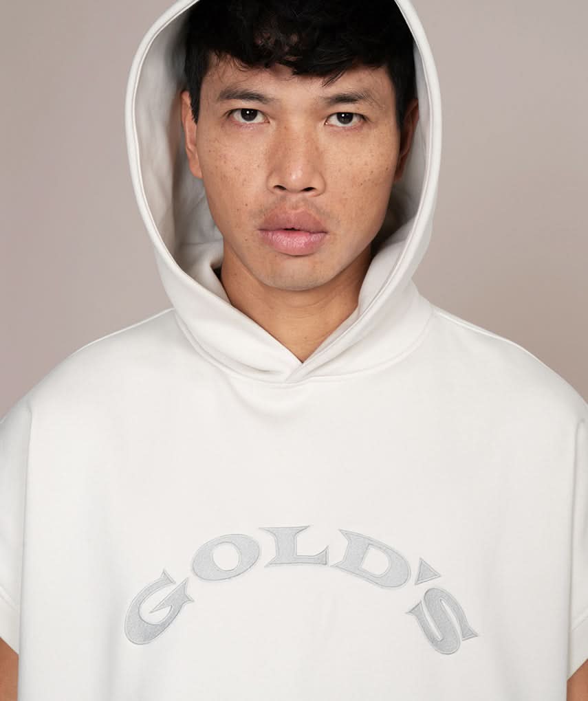 man in white golds gym hoodie