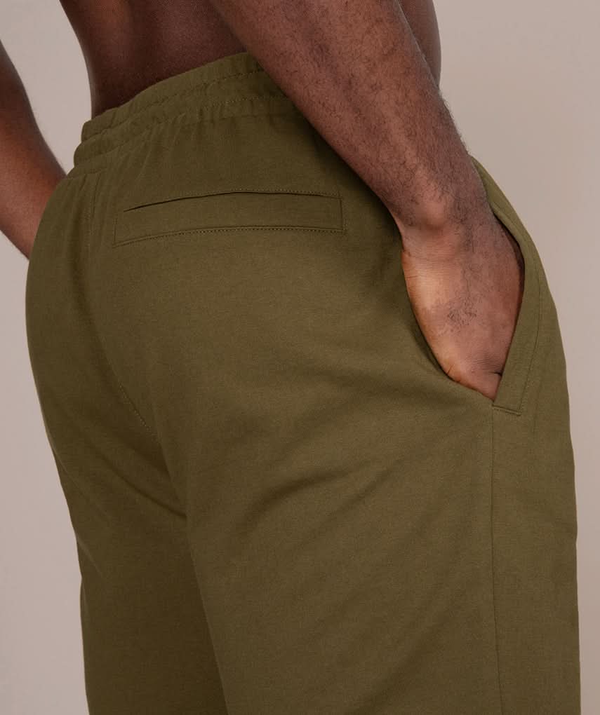 olive athletic gym shorts for men back side view