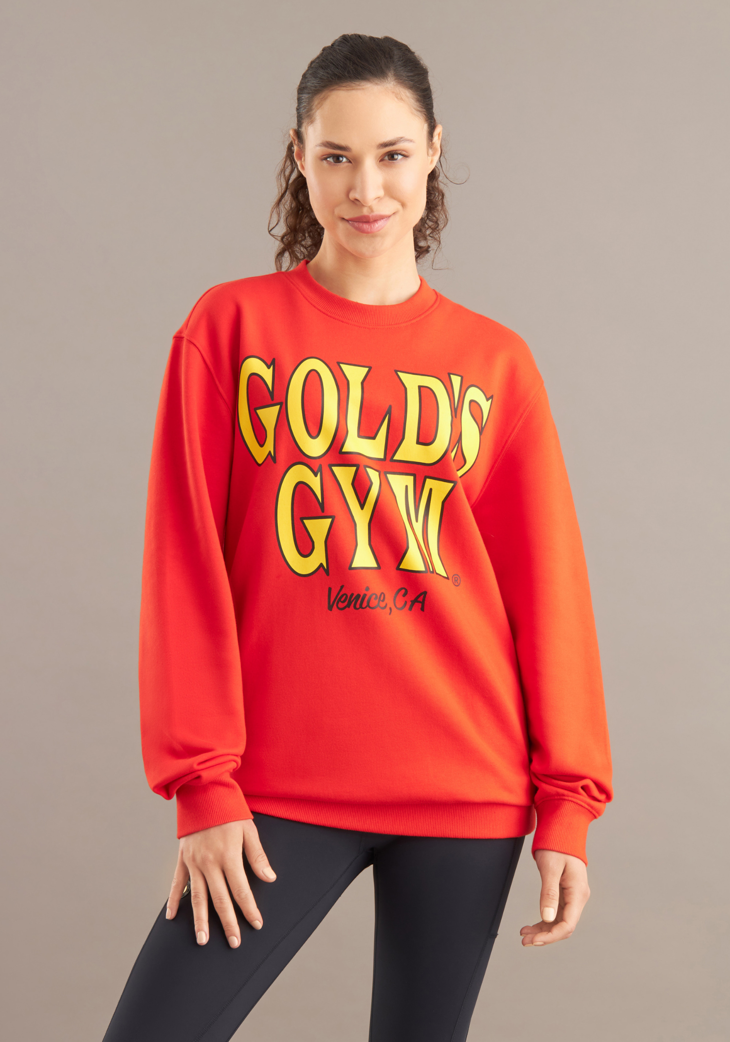 woman wearing golds gym red sweater 