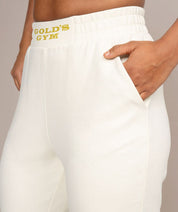 womens jogger sweatpants with golds gym logo in off white side view 